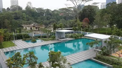 an overhead view of a swimming pool at a building at 3 Bedroom Cozy apartmet in Kuala Lumpur