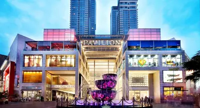 a large building with a purple vase in front of it at 3 Bedroom Cozy apartmet in Kuala Lumpur