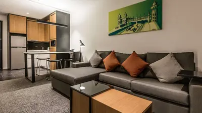 a living room with a couch and a table at Hyatt House Kuala Lumpur, Mont Kiara in Kuala Lumpur