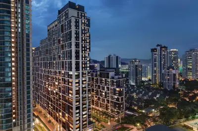 an aerial view of a tall building in a city at Hyatt House Kuala Lumpur, Mont Kiara in Kuala Lumpur