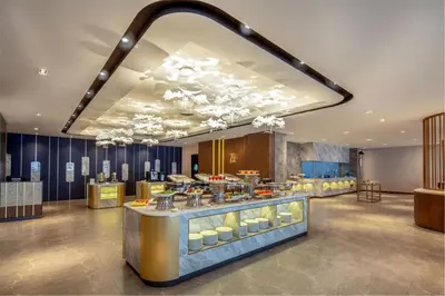 a restaurant with a buffet in the middle of a room at Dorsett Hartamas Kuala Lumpur in Kuala Lumpur