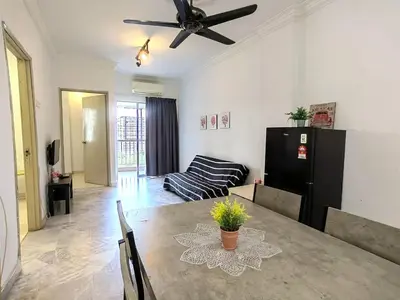 a living room with a dining room table with a ceiling fan at Setapak TerataiMewahApart to15min KLCC 217 in Kuala Lumpur