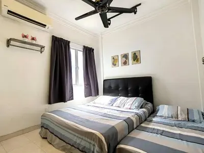 a bedroom with a bed and a ceiling fan at Setapak TerataiMewahApart to15min KLCC 217 in Kuala Lumpur