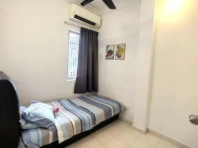 a small bed in a room with a window at Setapak TerataiMewahApart to15min KLCC 217 in Kuala Lumpur