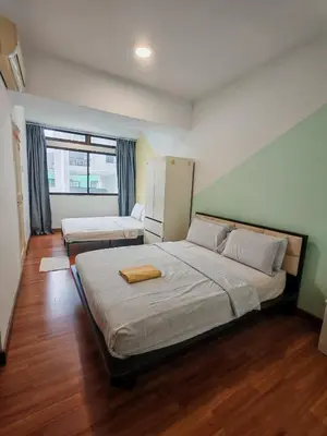 a bedroom with two beds and a large window at Fahrenheit 88 Pavillion Bukit Bintang Street AJ-HOME in Kuala Lumpur