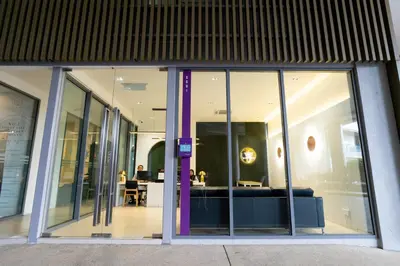 an entrance to an office building with glass windows at The Robertson Kuala Lumpur in Kuala Lumpur