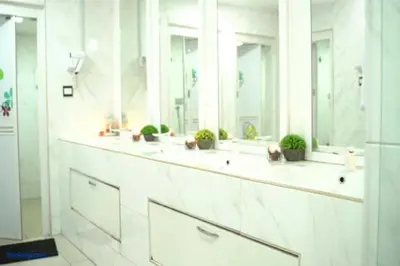 a bathroom with three sinks with potted plants on them at OYO 91036 J CAPSULE HOTEL @ JALAN BUKIT BINTANG in Kuala Lumpur