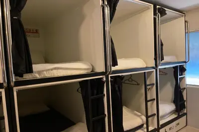 a group of bunk beds in a room at OYO 91036 J CAPSULE HOTEL @ JALAN BUKIT BINTANG in Kuala Lumpur