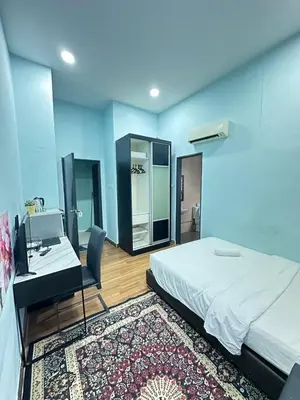 a bedroom with a bed and a desk and a mirror at Taragon Service Apartment- Next To LaLaport BBCC in Kuala Lumpur
