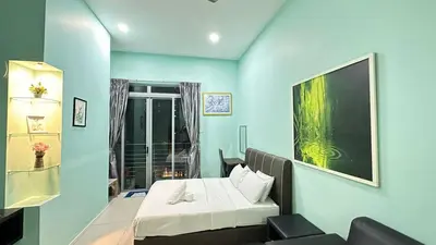 a blue room with a bed and a window at Taragon Service Apartment- Next To LaLaport BBCC in Kuala Lumpur