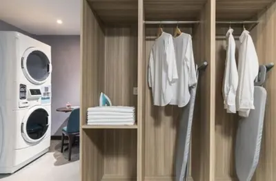 a laundry room with a washer and dryer at ibis Styles Kuala Lumpur Bukit Bintang in Kuala Lumpur