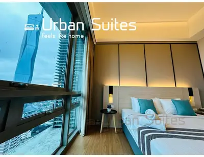 a hotel room with a bed and a window at Urban Suites @ Swiss Garden Residence in Kuala Lumpur