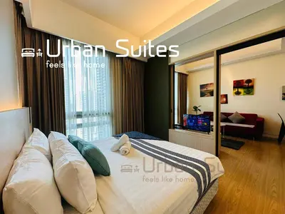 a hotel room with a bed in a bedroom at Urban Suites @ Swiss Garden Residence in Kuala Lumpur