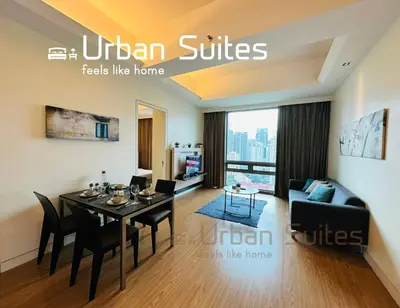 a living room with a dining table and a couch at Urban Suites @ Swiss Garden Residence in Kuala Lumpur