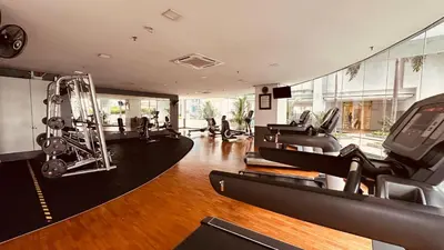 a gym with a bunch of cardio equipment in a room at Urban Suites @ Swiss Garden Residence in Kuala Lumpur