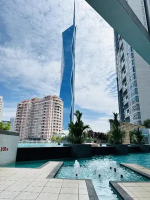 a view of a tall building from a swimming pool at Urban Suites @ Swiss Garden Residence in Kuala Lumpur