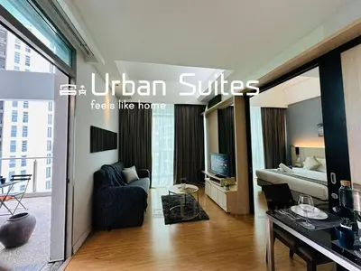 a living room with a hotel suite with a bed at Urban Suites @ Swiss Garden Residence in Kuala Lumpur