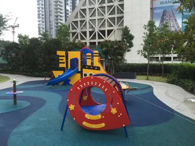 a playground with a slide in a park at M City Center Jalan Ampang Lakeview KLCC KL Tower Merdeka 118 TRX in Kuala Lumpur