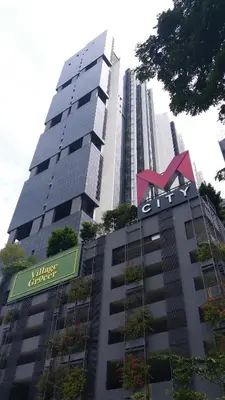 a tall building with a sign on top of it at M City Center Jalan Ampang Lakeview KLCC KL Tower Merdeka 118 TRX in Kuala Lumpur