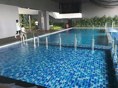 a large swimming pool with blue tiles in a building at M City Center Jalan Ampang Lakeview KLCC KL Tower Merdeka 118 TRX in Kuala Lumpur