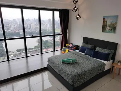 a bedroom with a bed and a large window at M City Center Jalan Ampang Lakeview KLCC KL Tower Merdeka 118 TRX in Kuala Lumpur