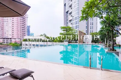a swimming pool in a city with tall buildings at SG Residence Kuala Lumpur in Kuala Lumpur