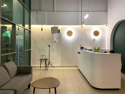 a living room with a couch and a counter at SG Residence Kuala Lumpur in Kuala Lumpur