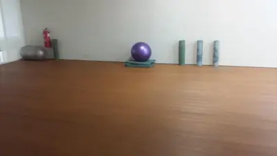 a room with a purple ball on a wooden floor at Soho Suites KL City Centre in Kuala Lumpur