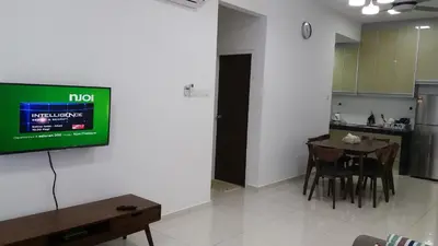 a living room with a television on a wall at Adna Homestay Wangsa Maju in Kuala Lumpur