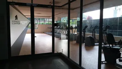 a gym with rows of chairs and a wall of glass at Adna Homestay Wangsa Maju in Kuala Lumpur