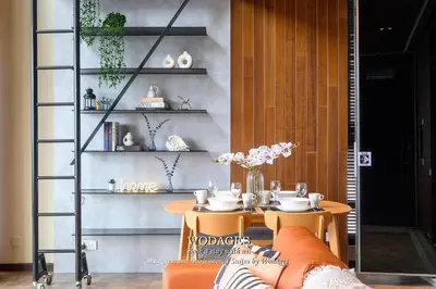 a dining room with a table and a shelf at Expressionz KLCC by Wodages in Kuala Lumpur