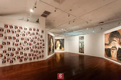 a room with many pictures on the wall at EXPRESSIONZ KLCC BY G Suites in Kuala Lumpur