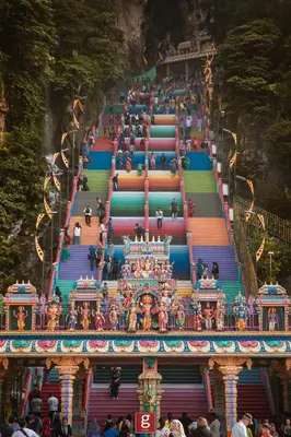 a group of people walking up a stairway at a temple at EXPRESSIONZ KLCC BY G Suites in Kuala Lumpur