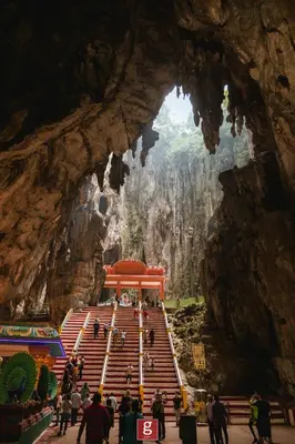 a group of people walking through a cave at EXPRESSIONZ KLCC BY G Suites in Kuala Lumpur