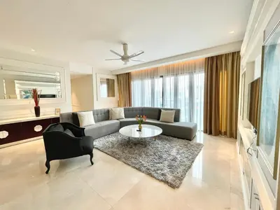 a living room with a couch and a table at KLCC Luxury Condo Damai 88 Near Gleneagles Hospital in Kuala Lumpur
