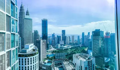 an aerial view of a city with tall buildings at Soho Suites KLCC by Alucard's Cat in Kuala Lumpur