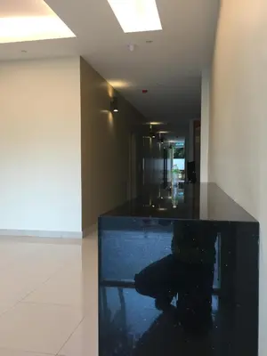 a hallway with a black counter in a building at Festival Boutique Hotel @ Kampung Pandan in Kuala Lumpur