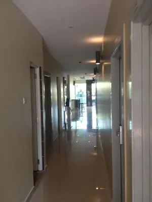 an empty hallway of an office building with a long corridor at Festival Boutique Hotel @ Kampung Pandan in Kuala Lumpur