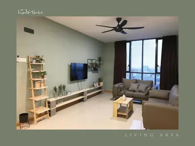 a living room with a couch and a ceiling fan at KL Gateway Mall - Easy Access to KL Sentral & KLCC in Kuala Lumpur
