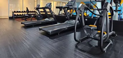 a gym with several treadmills and cardio machines at Days Hotel & Suites by Wyndham KL - Chan Sow Lin MRT or LRT in Kuala Lumpur