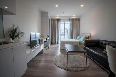 a living room with a couch and a tv at Perfect Location@ Heart of KL City Centre next to Metro MRT in Kuala Lumpur