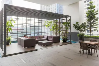 a living room with a couch and a table at Perfect Location@ Heart of KL City Centre next to Metro MRT in Kuala Lumpur