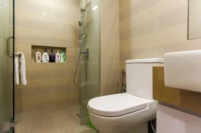 a bathroom with a toilet and a glass shower at Perfect Location#2 @Heart of KL City Centre next to Metro MRT in Kuala Lumpur