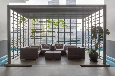 a living room with a couch and a large window at Perfect Location#2 @Heart of KL City Centre next to Metro MRT in Kuala Lumpur