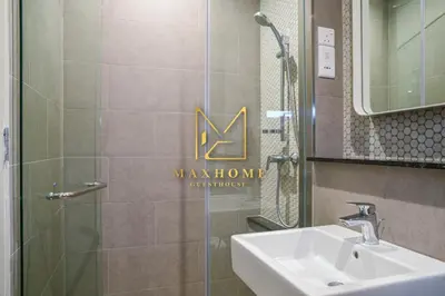 a bathroom with a sink and a shower with a mirror at Maxhome at Lucentia Bukit Bintang City centre KL in Kuala Lumpur