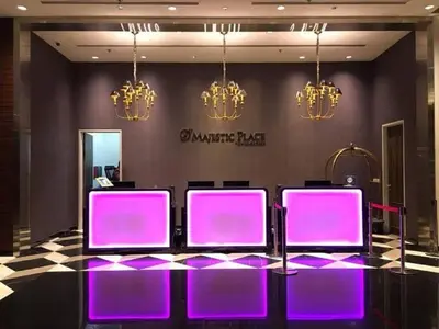 a group of purple chairs in a room with chandeliers at Maxhome @ D'Majestic Place, KL City Centre in Kuala Lumpur
