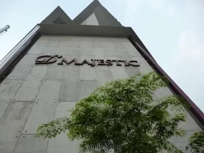 a sign on the side of a building at Maxhome @ D'Majestic Place, KL City Centre in Kuala Lumpur