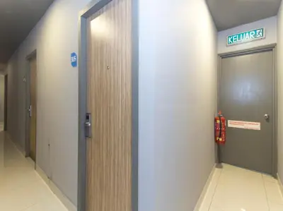 a hallway with two elevators in a building at i-Hotel Kuala Lumpur in Kuala Lumpur
