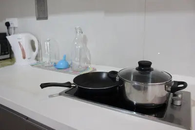 a pot sitting on top of a stove at ✦Time & Traveller✦Regalia Suites and Residence✦KLCC view Infinity Pool✦双子塔无边泳池 in Kuala Lumpur