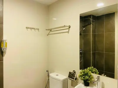 a bathroom with a toilet and a sink and a shower at Asia Like Boutique Hotel in Kuala Lumpur